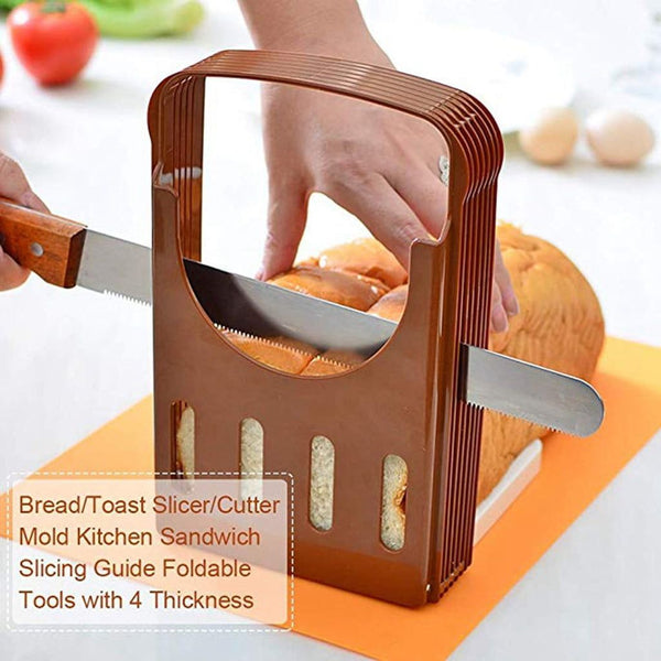 Bread/toast slicer/cutter being used to slice a loaf of bread on a kitchen counter.