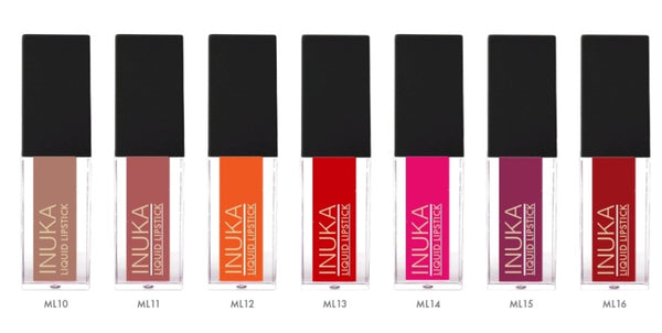 A collection of seven INUKA matt liquid lipsticks in a variety of colors, with unique arrow-shaped tips, displayed in clear tubes.